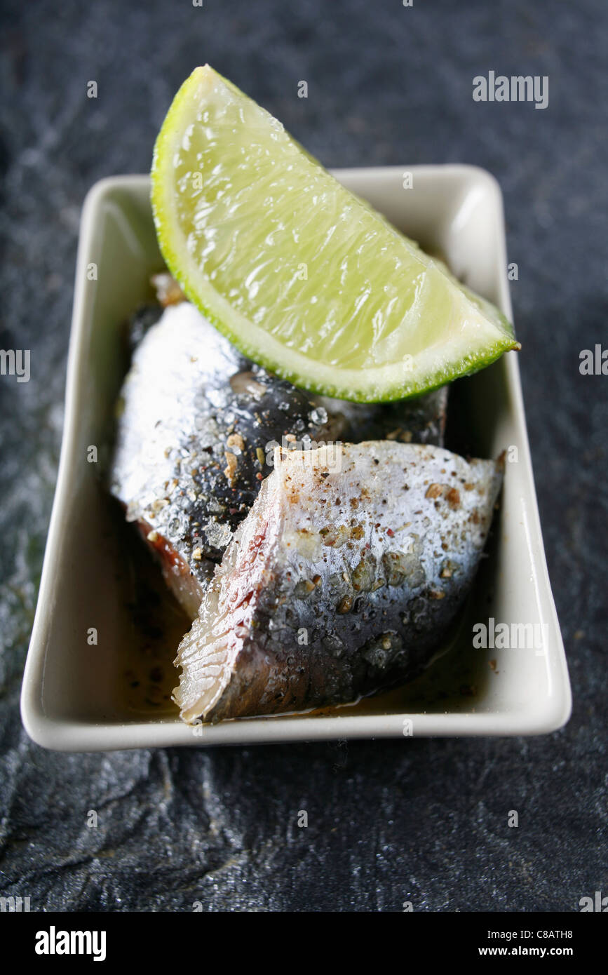 Raw sardines with soja-lime sauce Stock Photo