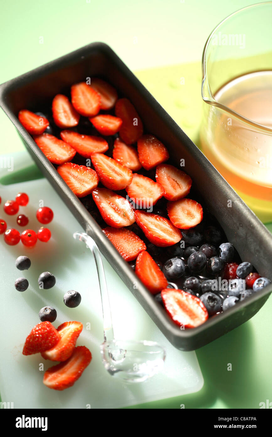 Placing the summer fruit in the terrine Stock Photo Alamy