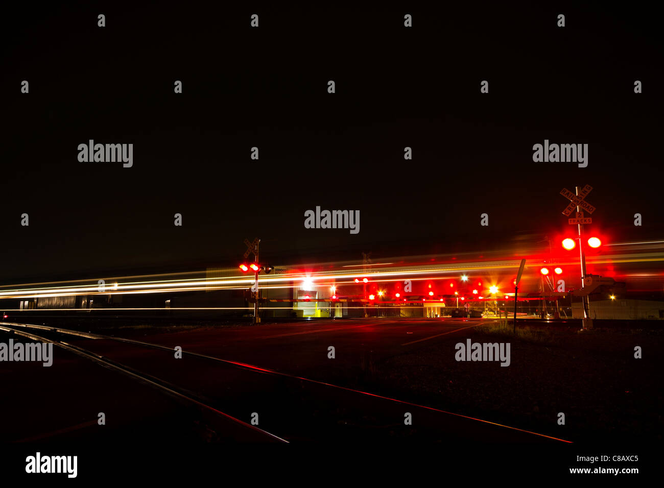 Railroad crossing warning devices long exposure Stock Photo