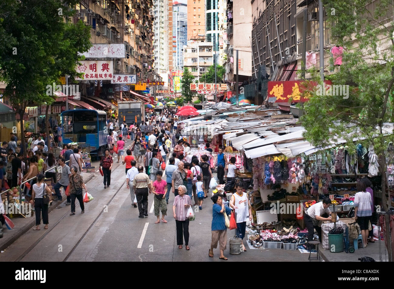 Street market in Hong Kong selling everything from cloths to live animals and food. The more real image of asian market growht Stock Photo