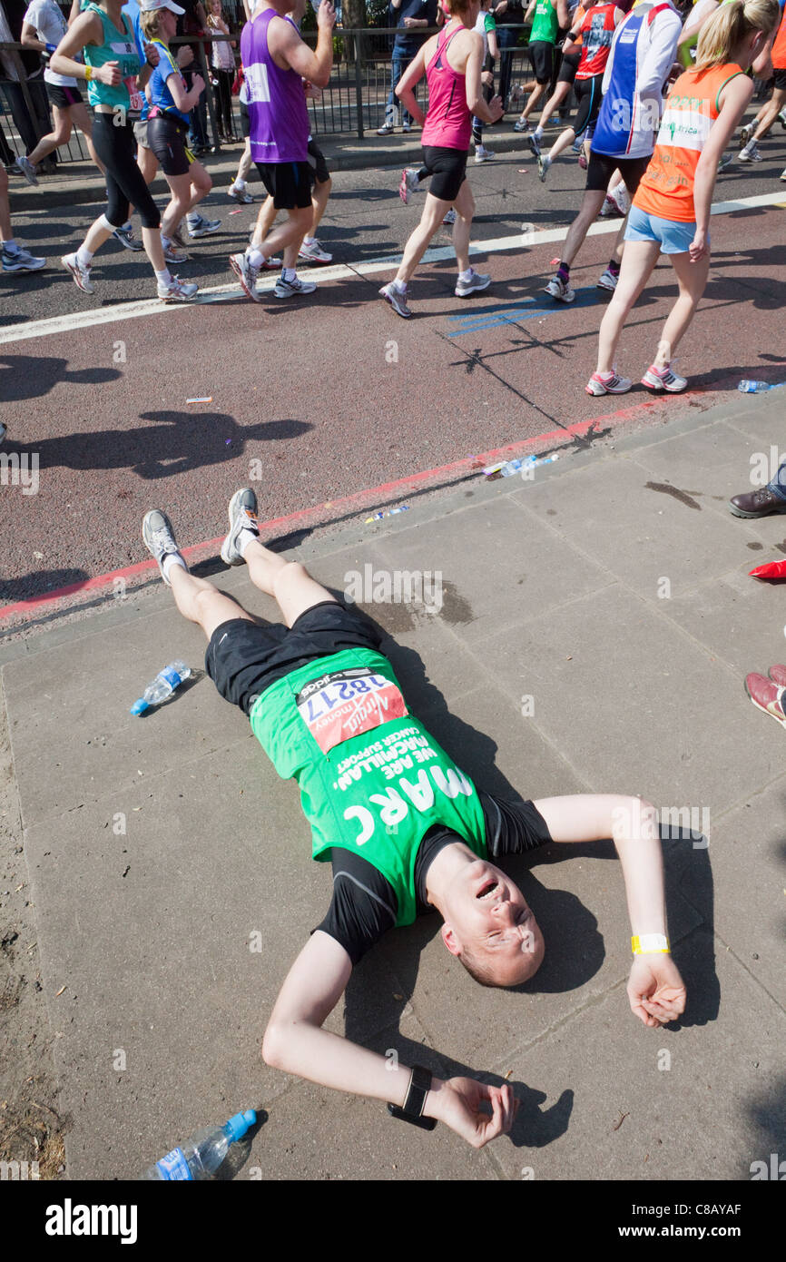 England, London, London Marathon, Fallen Runner Suffering from Cramp