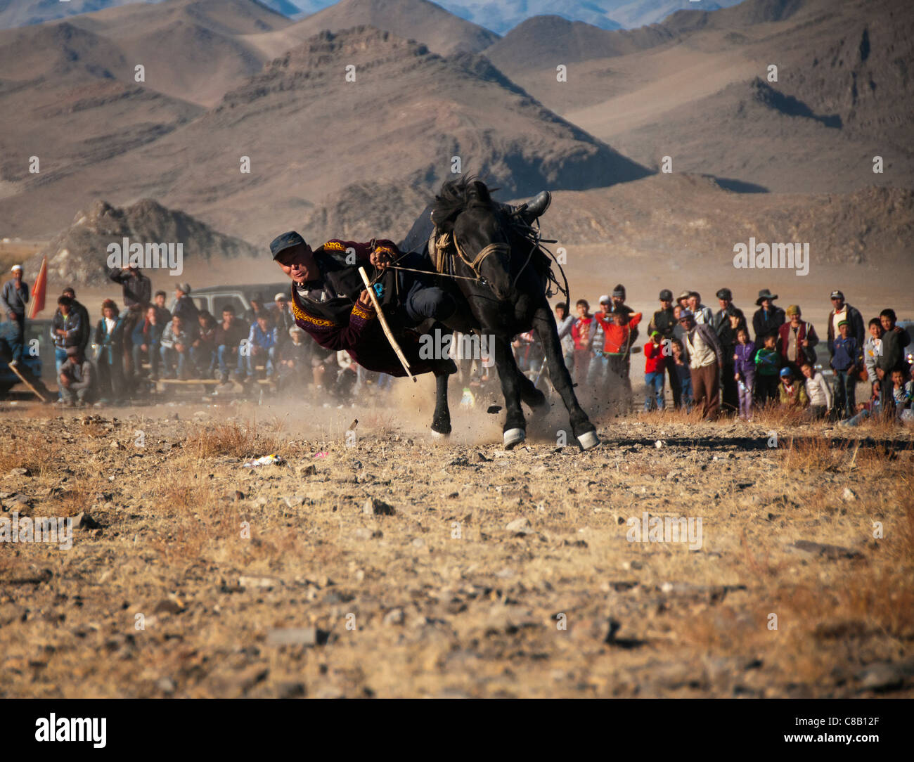 Kazakhs playing tenge alu, a horseback game of skill in Bayan Olgii, Mongolia Stock Photo