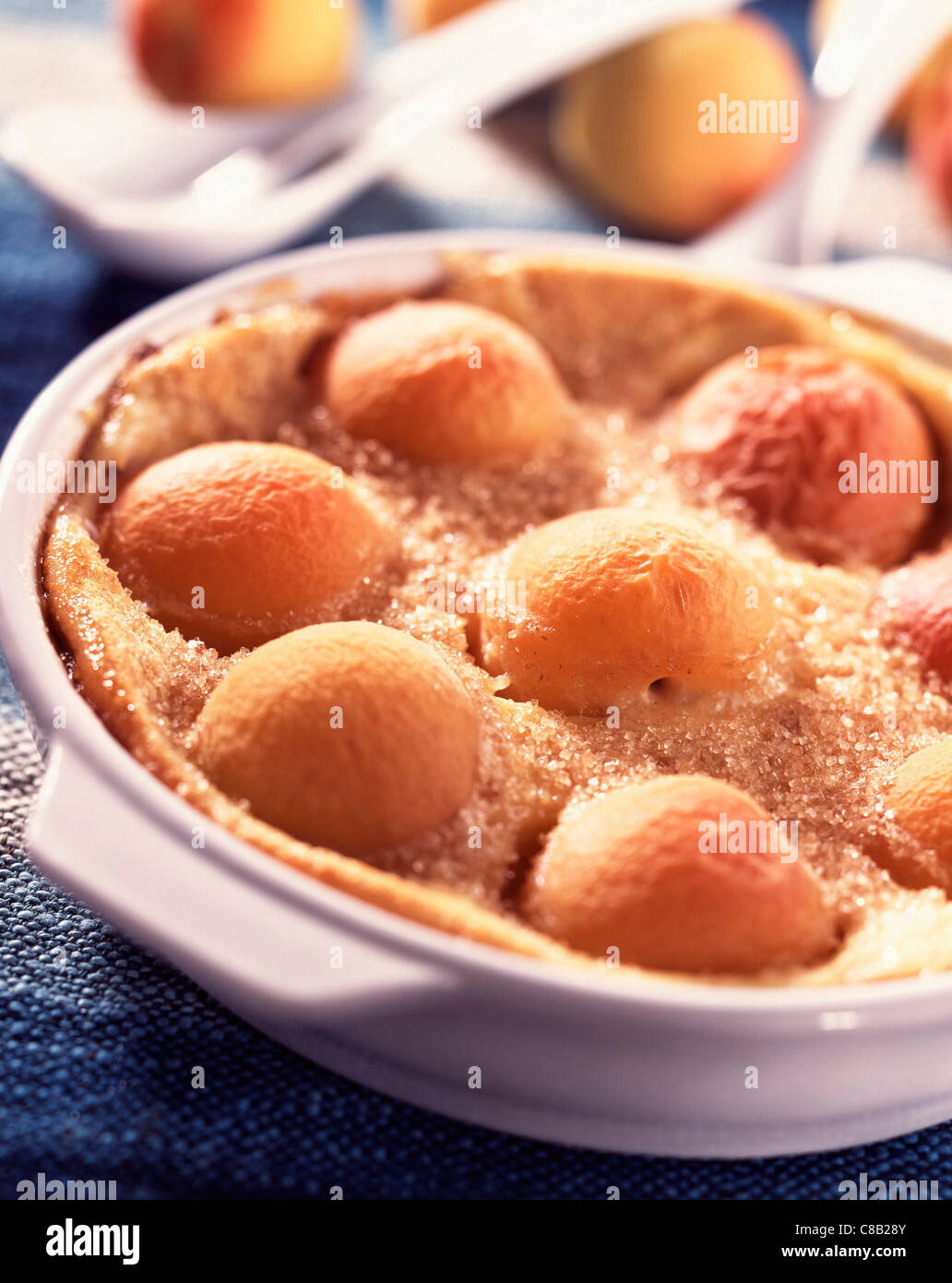 Warm Clafouti batter pudding with apricots Stock Photo