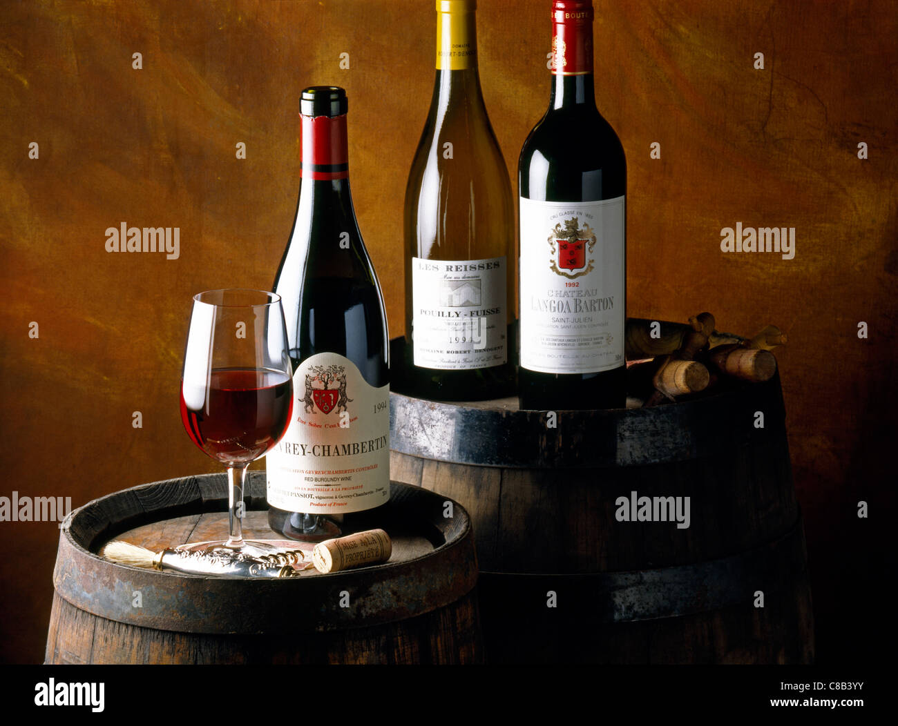 bottles of wine on barrels Stock Photo Alamy