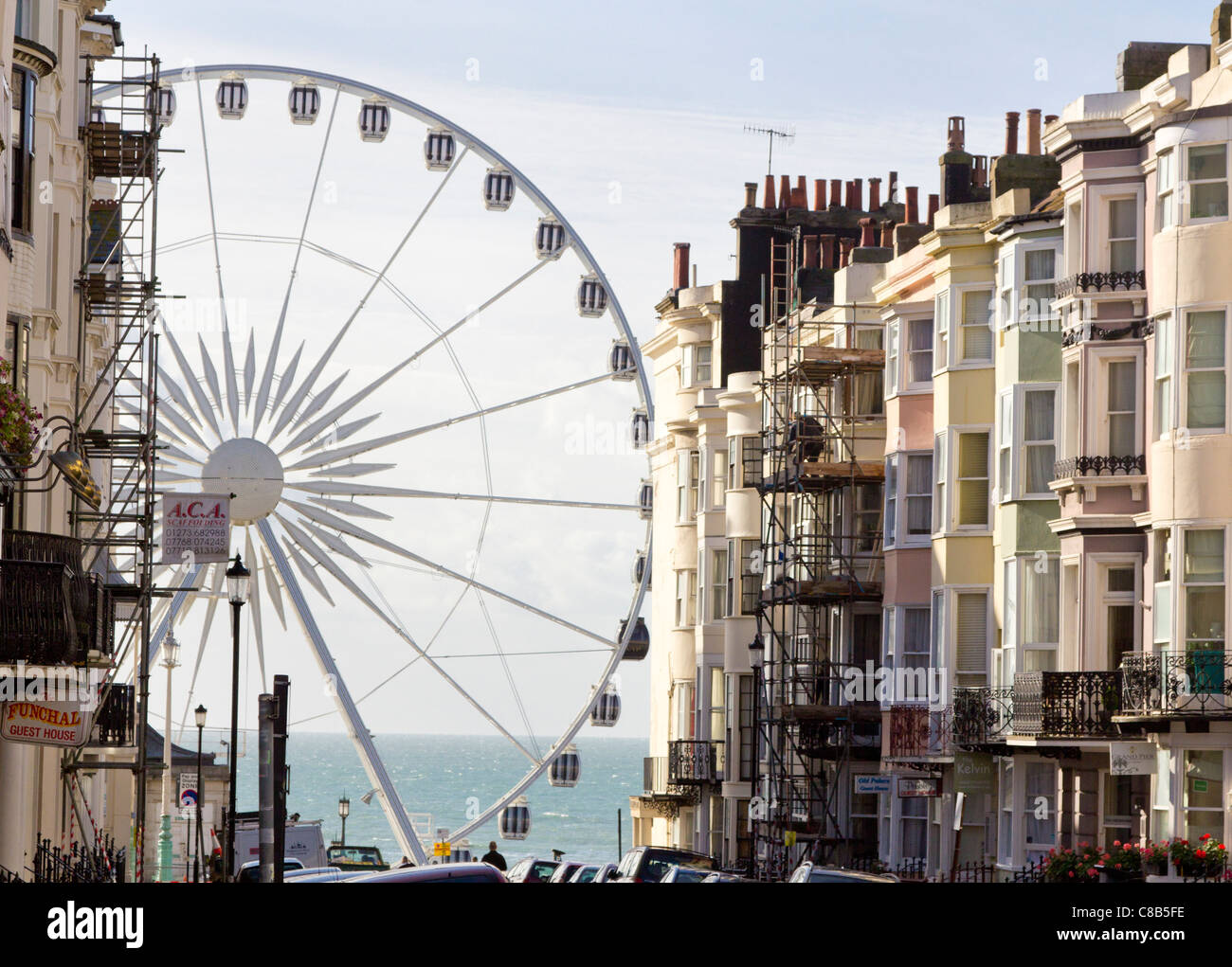 Looming above the streets of Kemp Town in Brighton is the Brighton Wheel Stock Photo