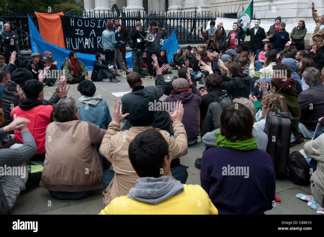 Occupy London in front of St Paul's. Part of worldwide protest . Group meeting Stock Photo