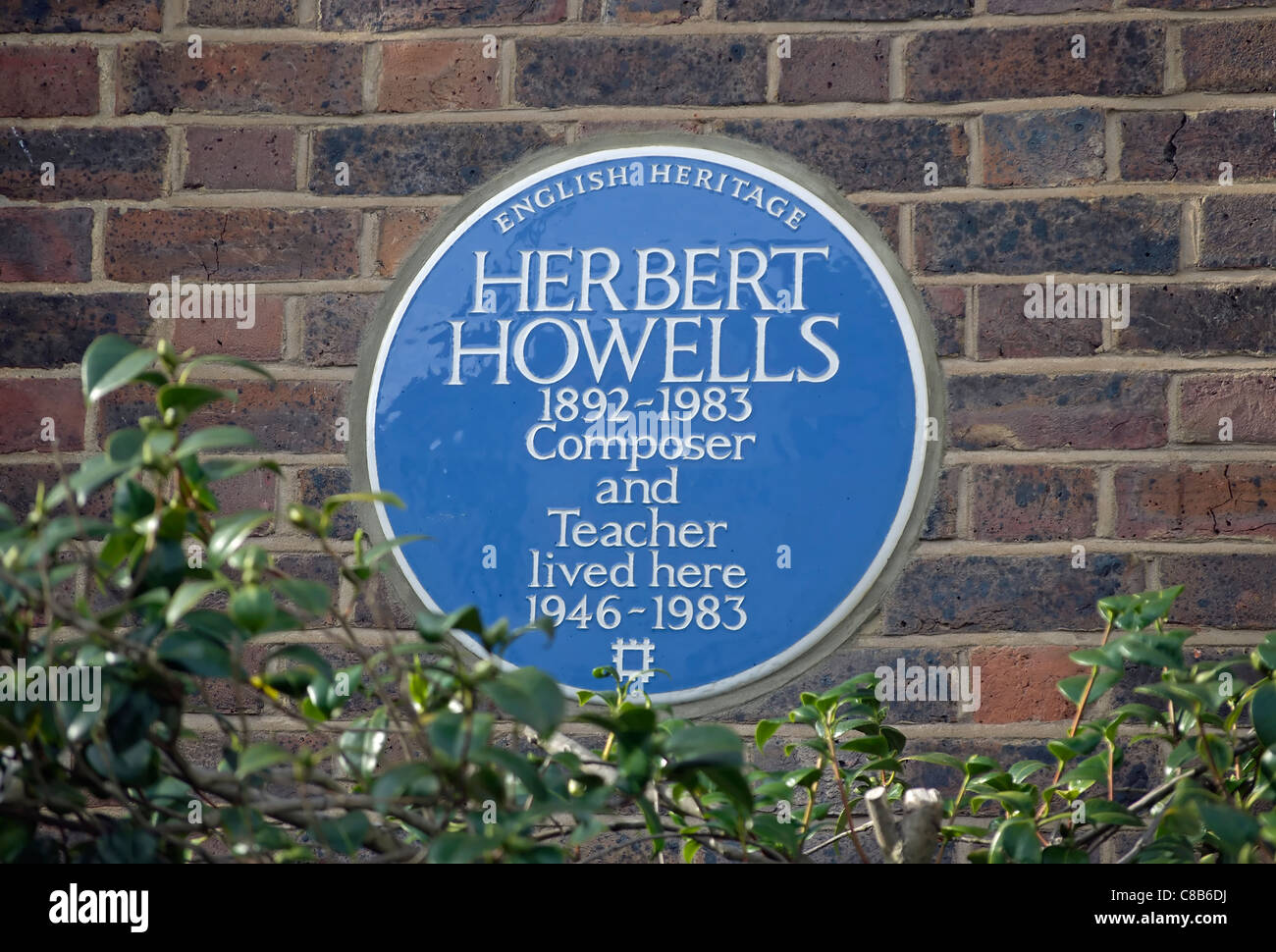 english heritage blue plaque marking a home of composer and teacher herbert howells, barnes, southwest london, england Stock Photo