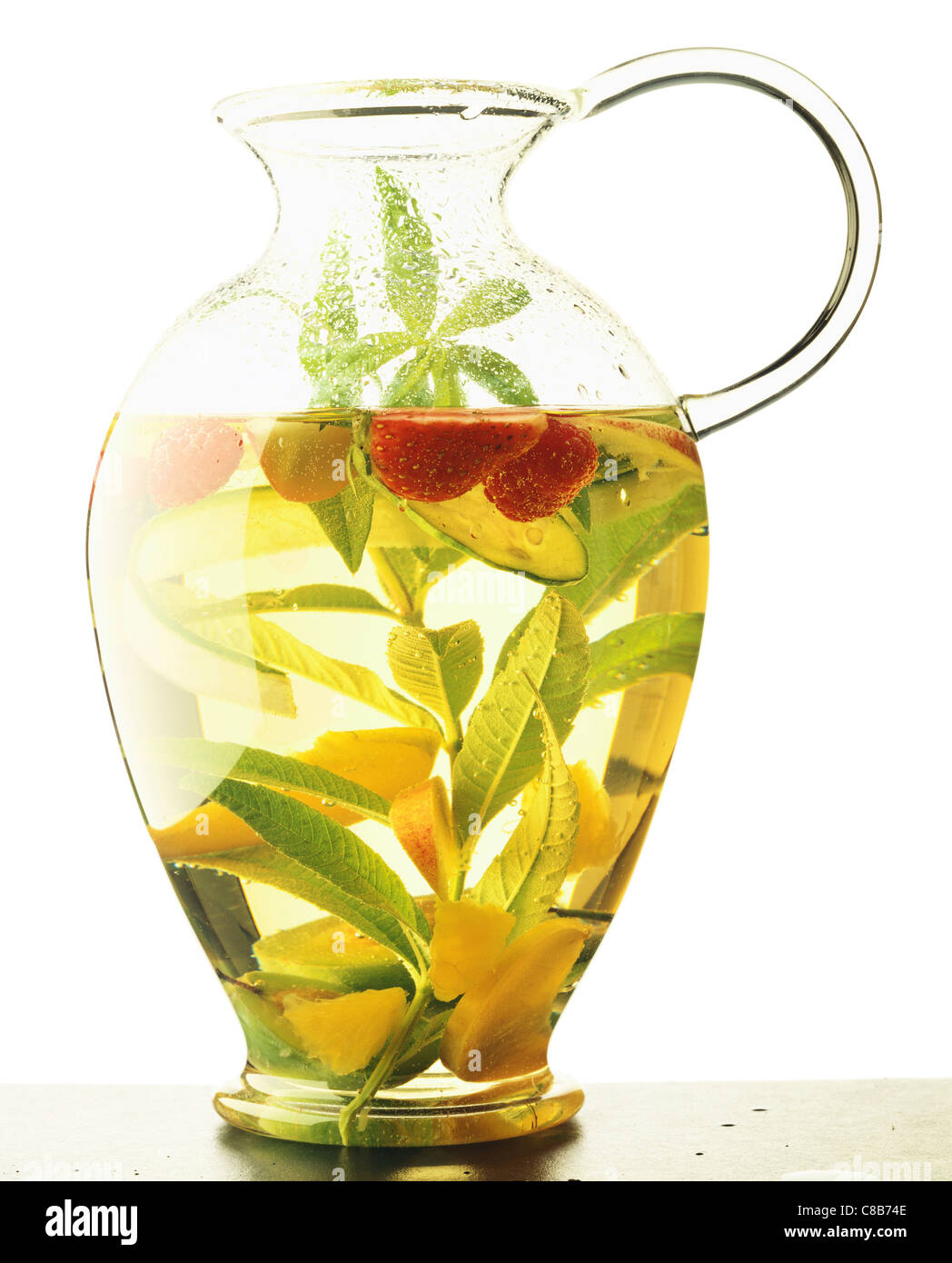 Jug of fruit macerated with herbs Stock Photo Alamy