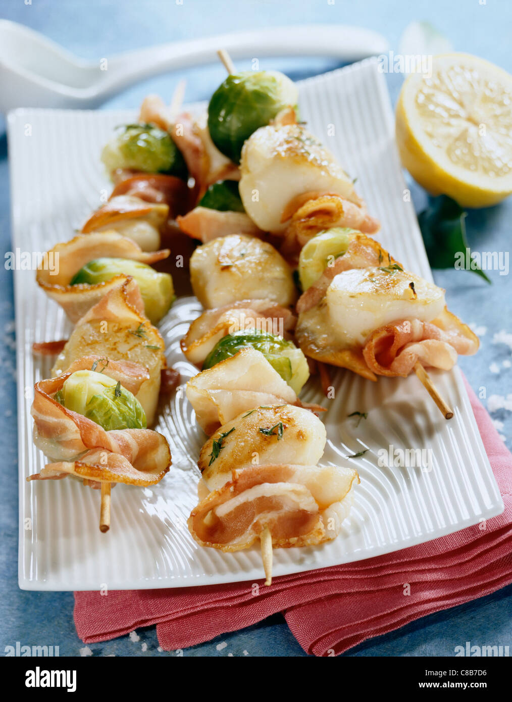 Brussels sprout, bacon and scallop kebabs Stock Photo Alamy