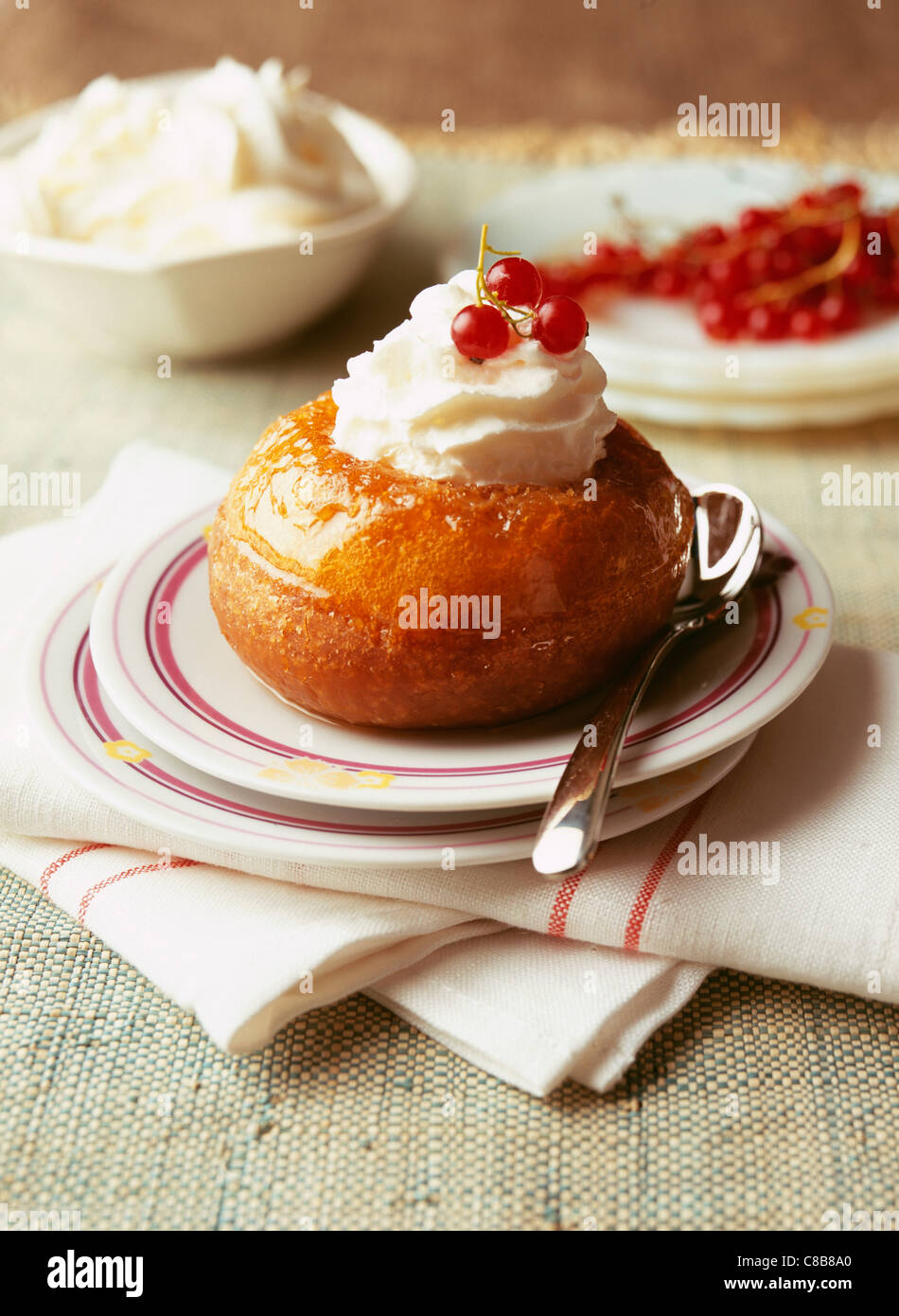 Rum Baba with whipped cream Stock Photo Alamy