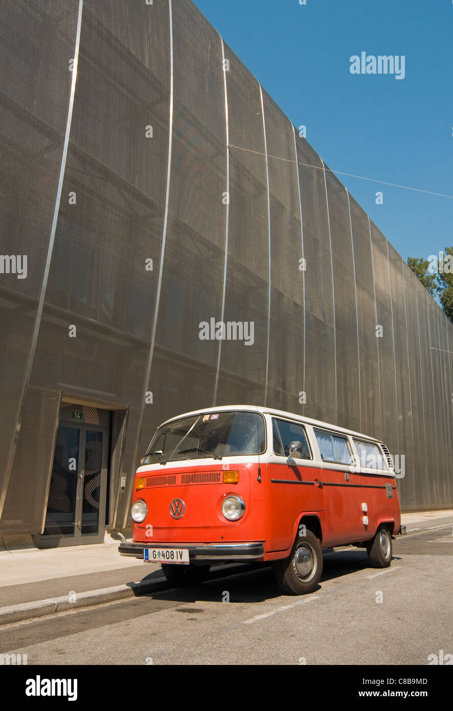 Classic Red VW (Volkswagen) T2 Van outside MUMUTH (House of Music and Music Drama) Buidling, Kunst University Graz, Austria Stock Photo