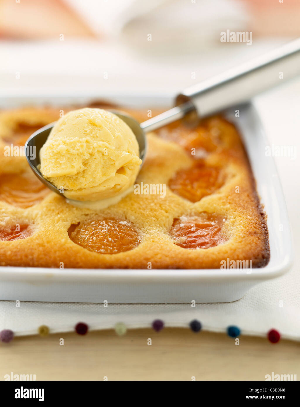 Apricot baked gratin with amaretto ice cream Stock Photo Alamy