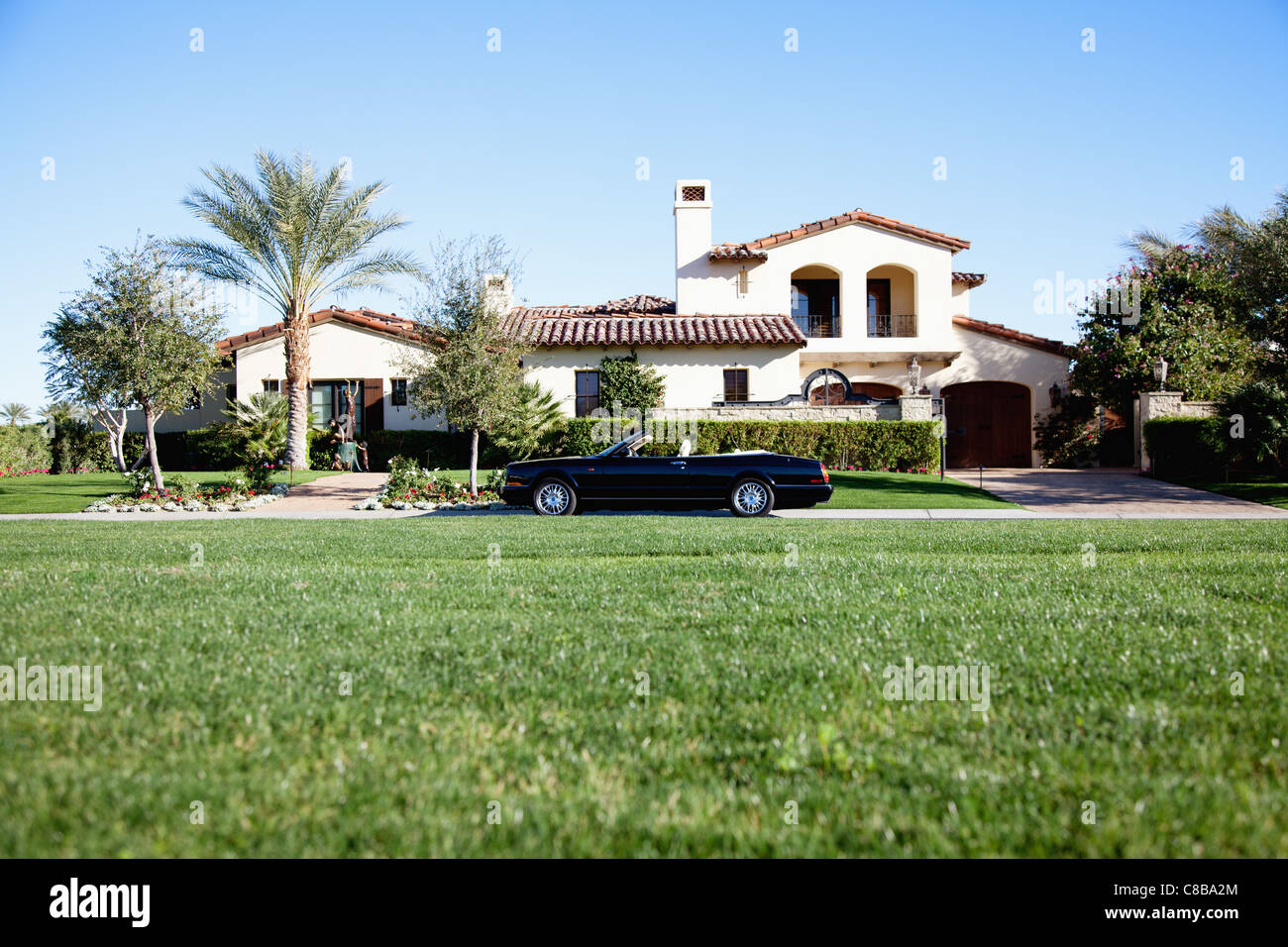 Luxury car outside house hires stock photography and images Alamy