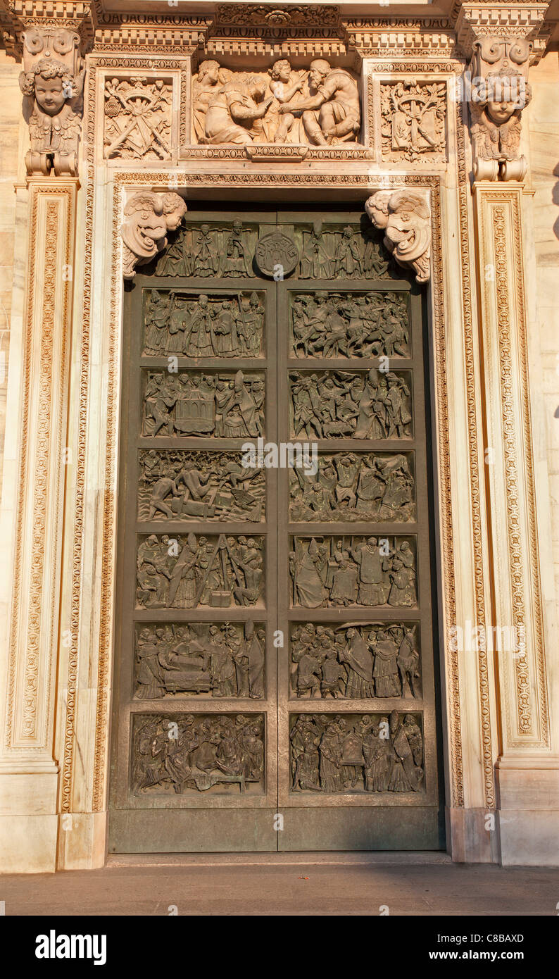 Milan - side bronze gate of Duomo cathedral Stock Photo