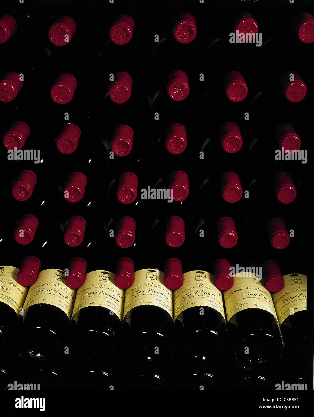 bottles of wine in rack Stock Photo - Alamy