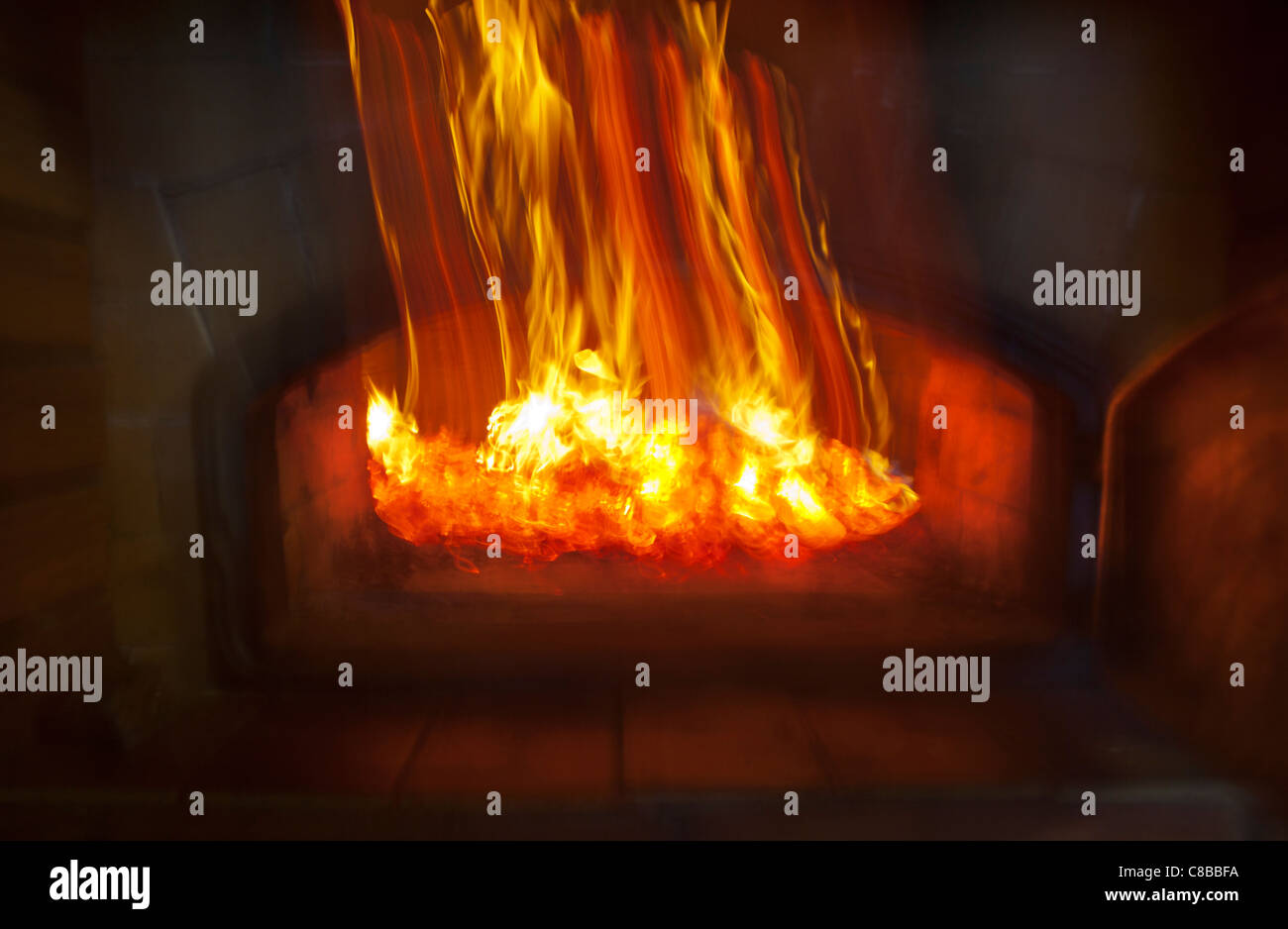 Wood coals glowing inside fireplace , Finland Stock Photo