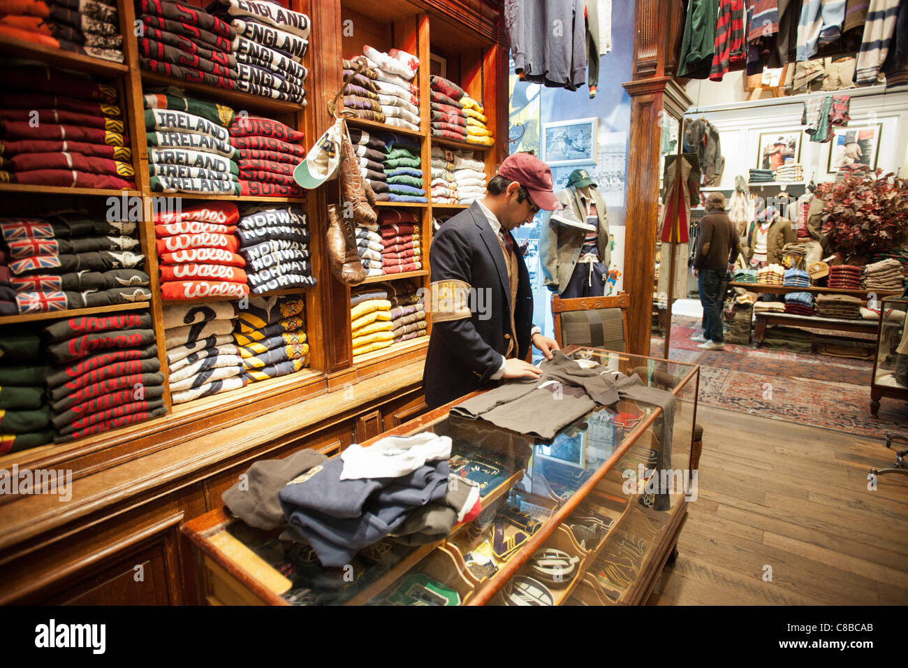 A clerk folds clothing in the Ralph Lauren Rugby store in Greenwich Village  on Saturday, October 15, 2011. (© Richard B. Levine Stock Photo - Alamy