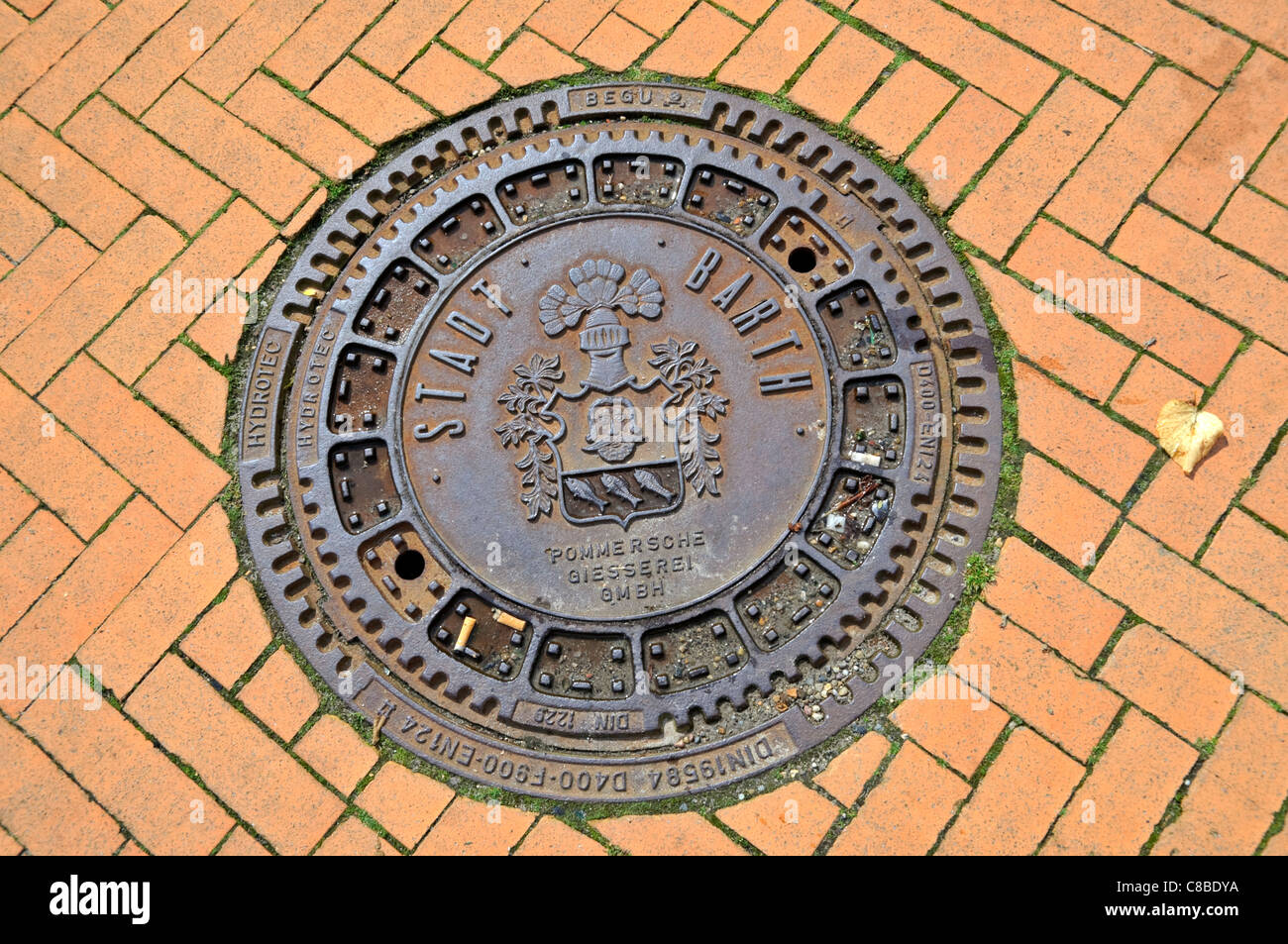 Man-hole cover in Barth, Mecklenburg-Vorpommern, Germany. Stock Photo