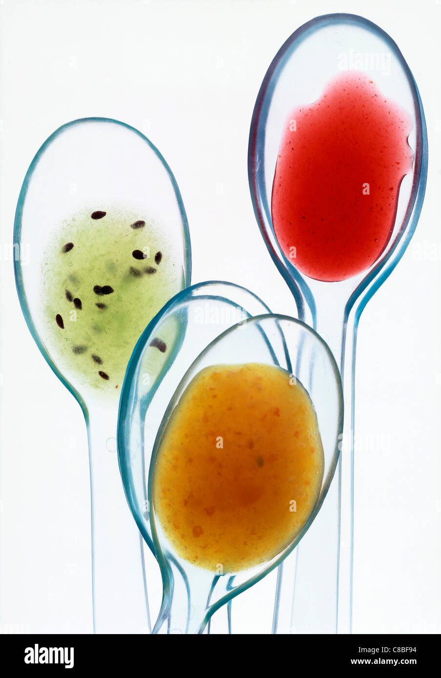 spoonfuls of kiwi and summer fruit puree Stock Photo - Alamy