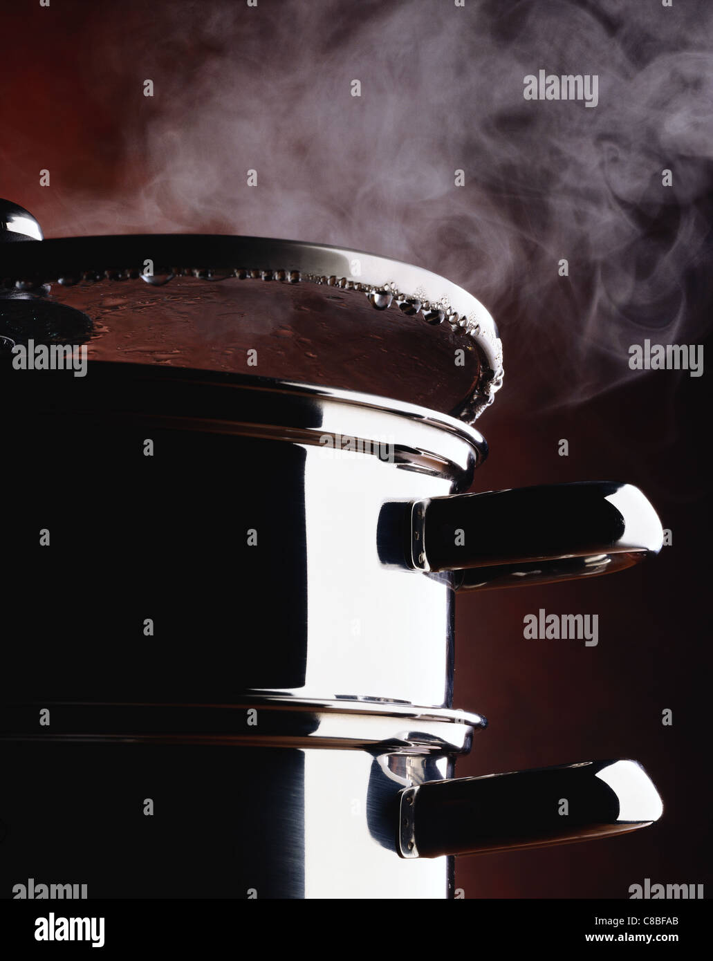 stacked steaming pans Stock Photo - Alamy