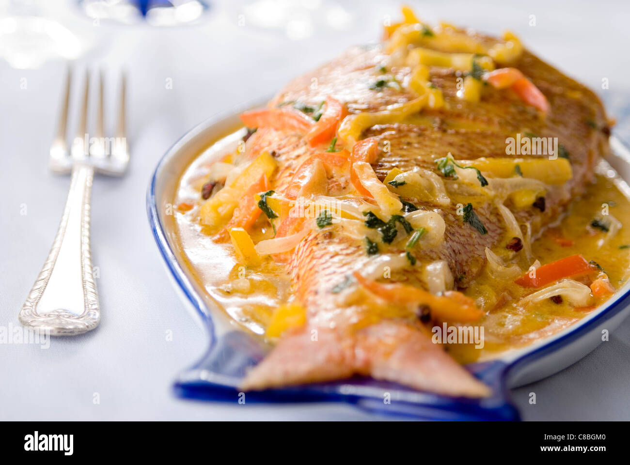 Fish in coconut sauce Stock Photo Alamy