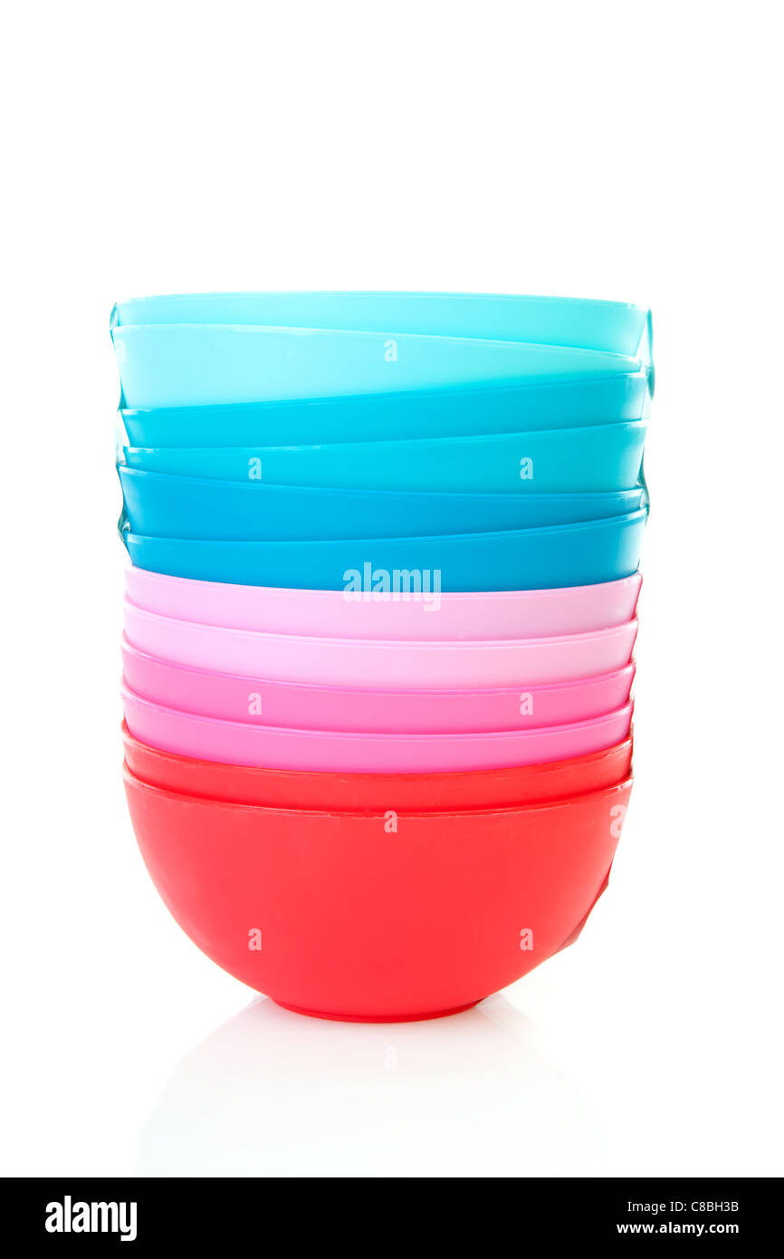 Pile of colorful plastic bowls over white background Stock Photo Alamy