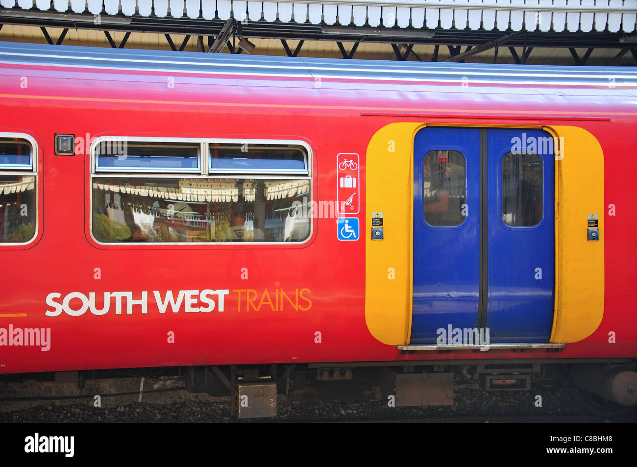 Train on platform at Clapham Junction Railway Station, Battersea, London Borough of Wandsworth, London, England, United Kingdom Stock Photo