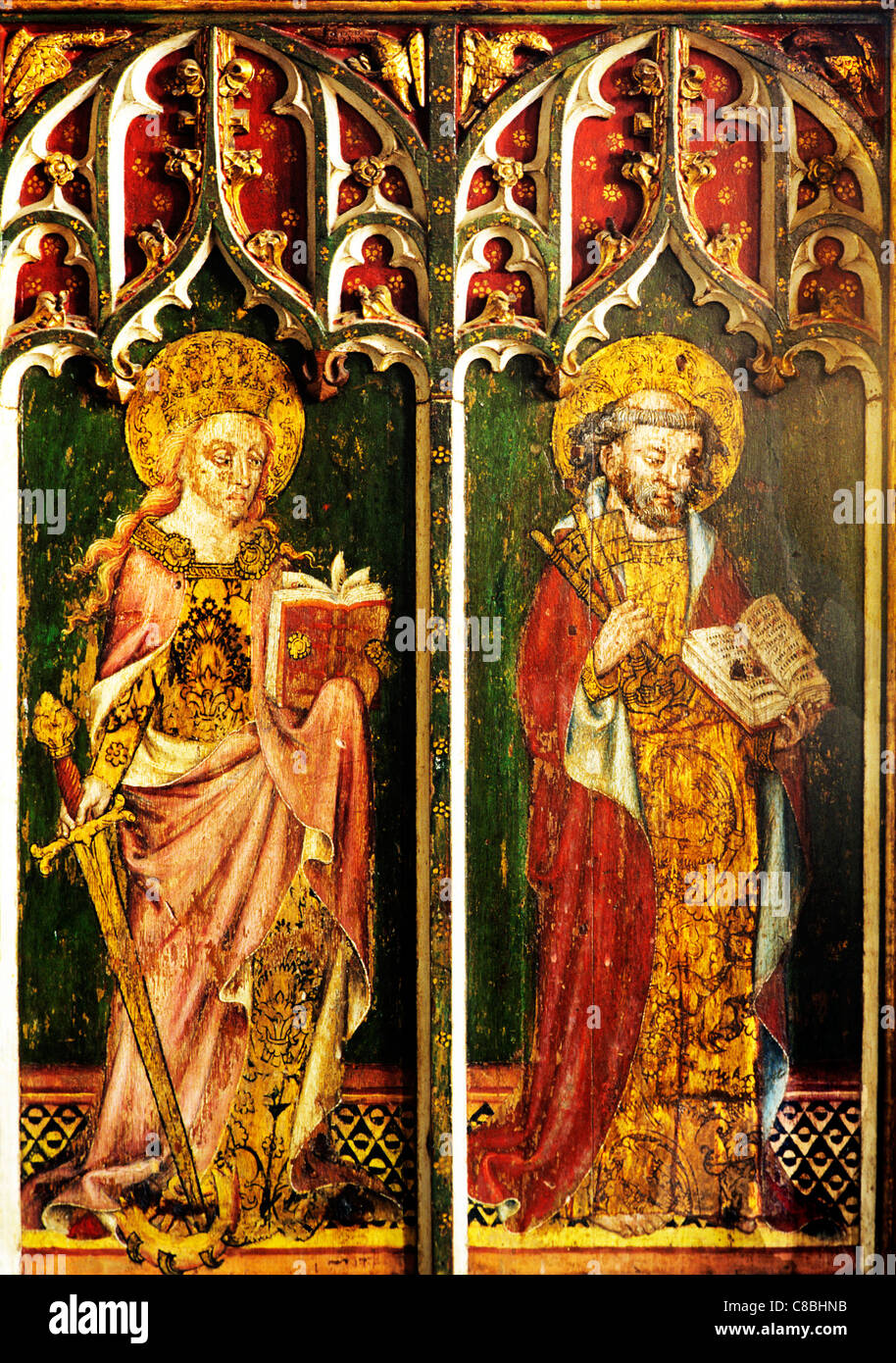 Filby, Norfolk, rood screen, St. Catherine of Alexandria, with sword, book and wheel, St. Peter with keys, female male saint Stock Photo