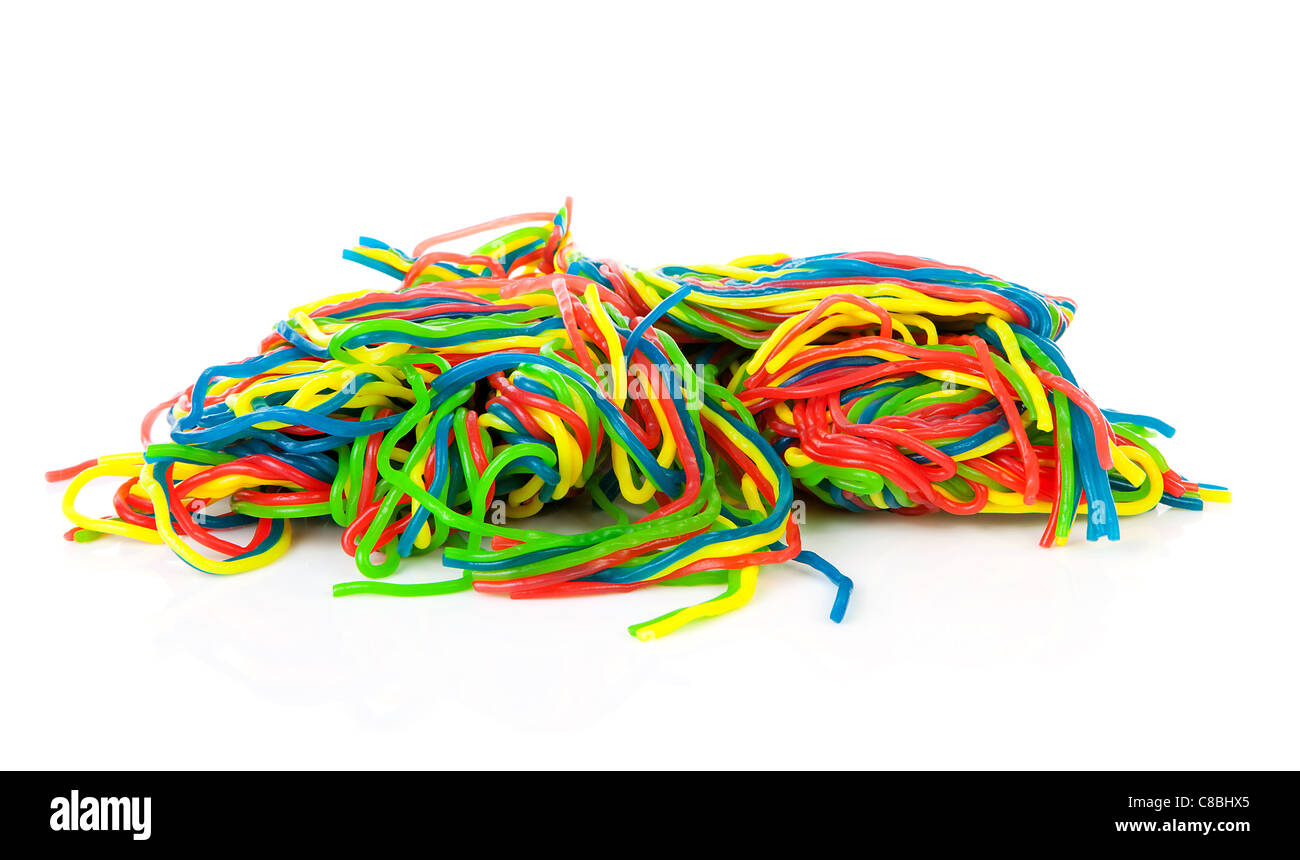 Pile of colorful fruit laces candy over white background Stock Photo