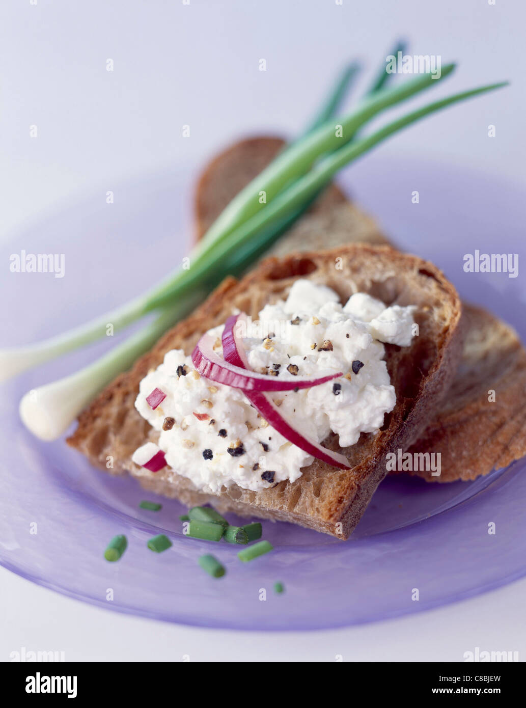 Cottage cheese and chives on bread Stock Photo Alamy
