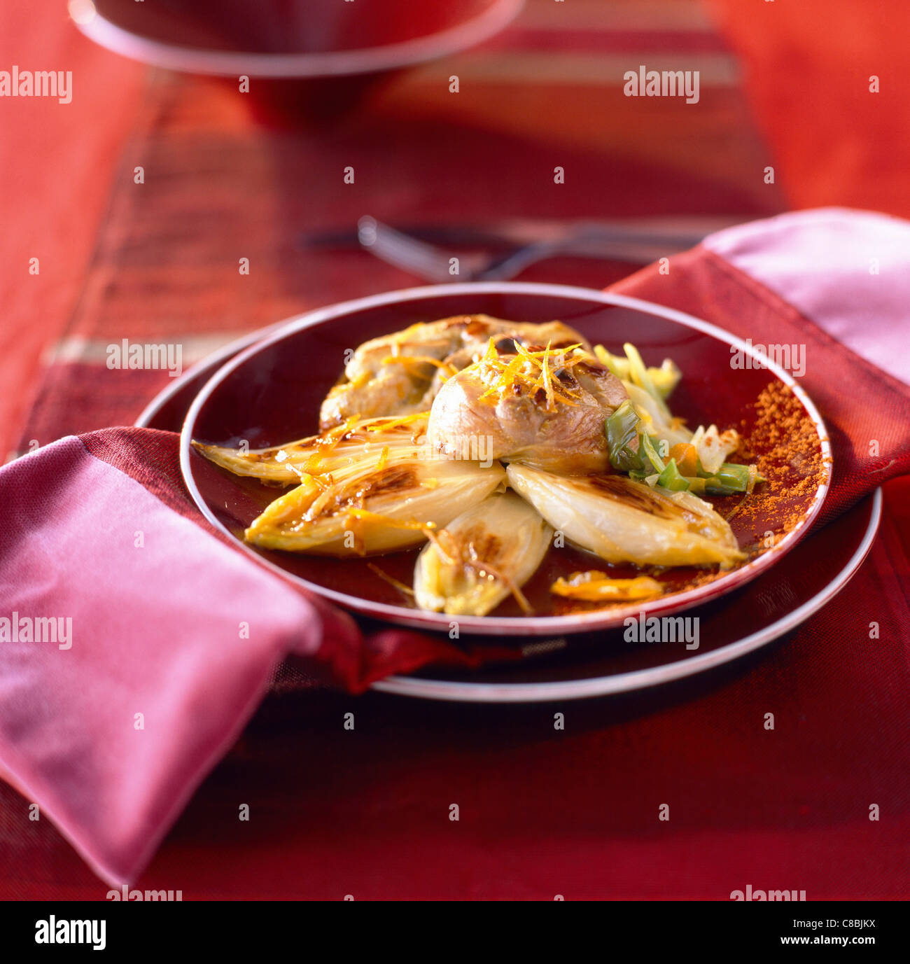 turkey and braised endives with orange Stock Photo Alamy