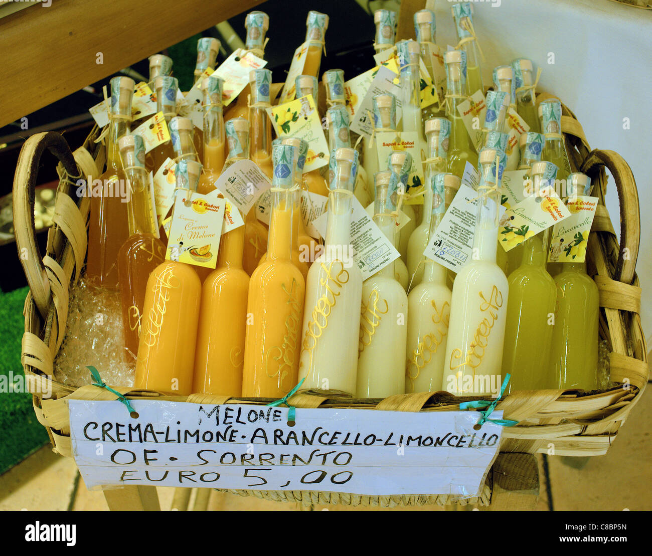 Limoncello and arancello liquor in souvenir bottles on display Amalfi Costiera Amalfitana Italy Stock Photo