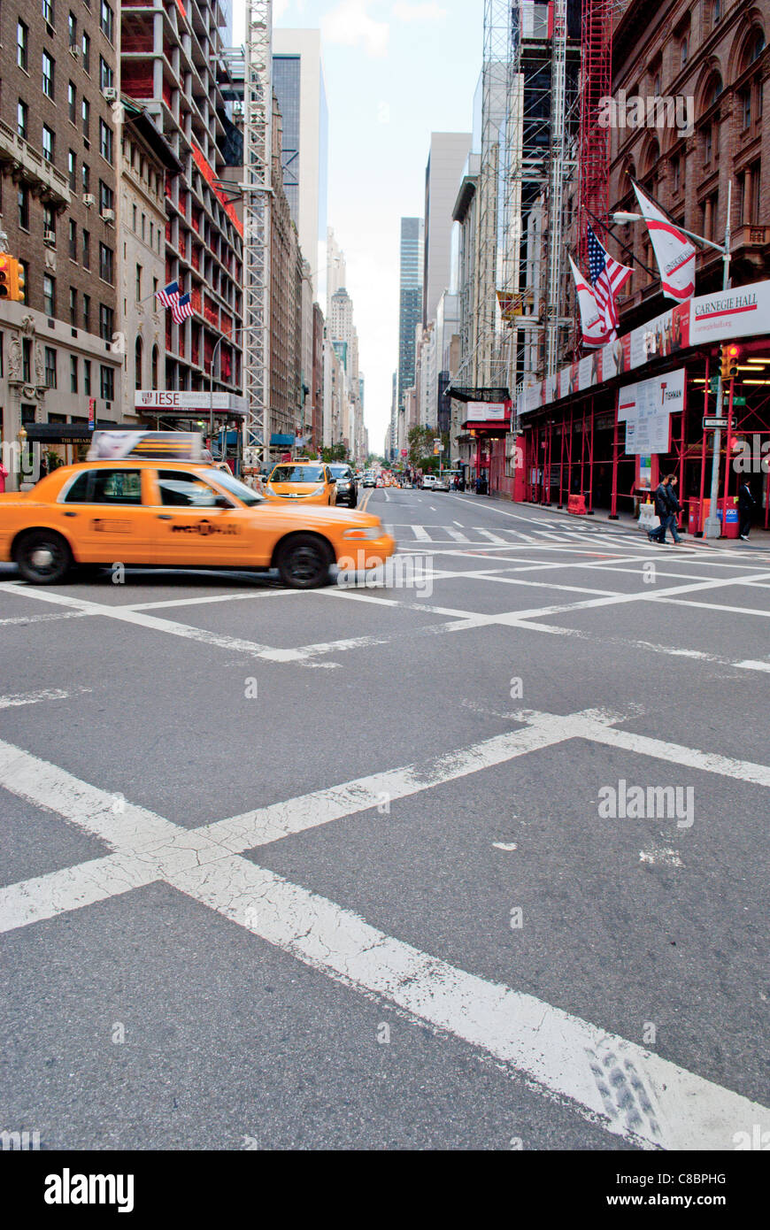 Street in New York city with a yellow cab. Stock Photo