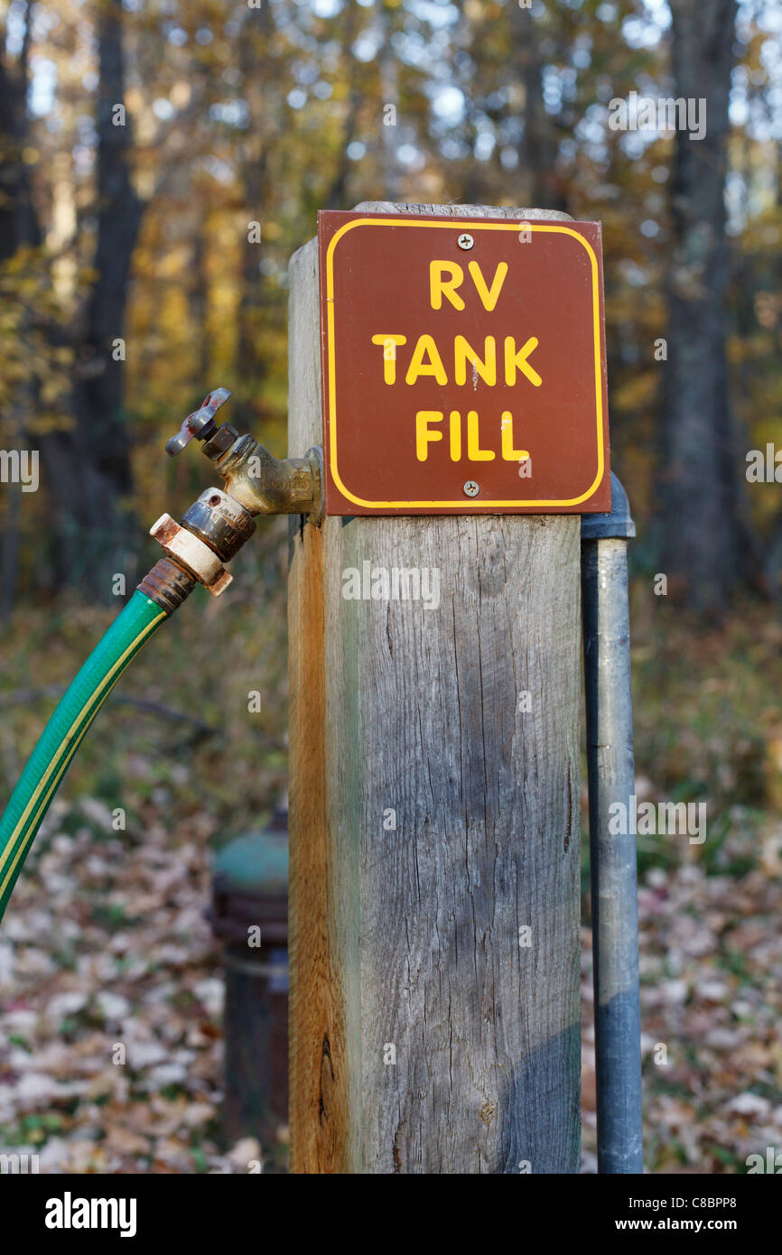 RV tank fill station in a forest campground. Stock Photo