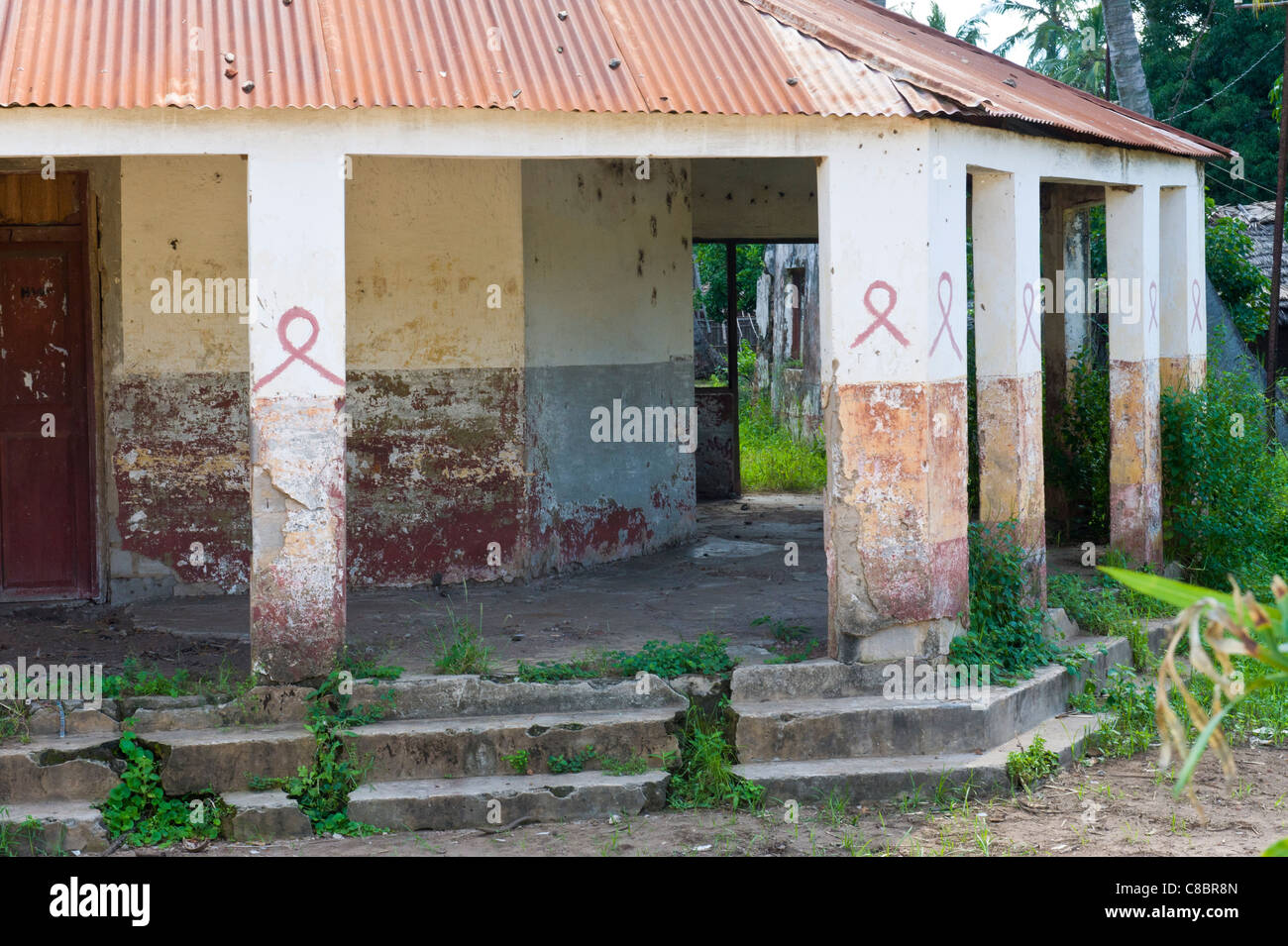 The red ribbon is an international symbol of AIDS awareness in Quelimane Mozambique Stock Photo