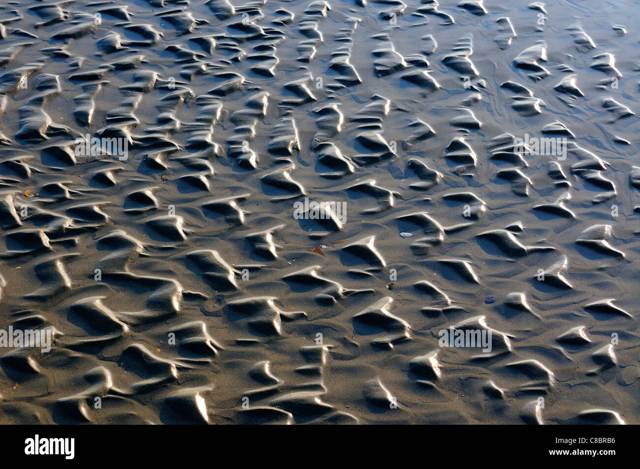 Patterns in the sand at West Wittering beach from the outgoing tide ...