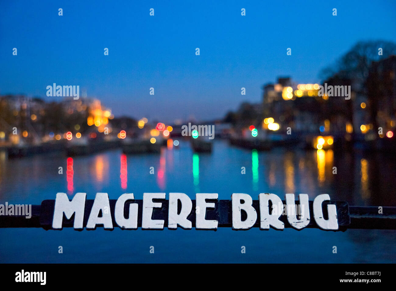 Sign on the Magere Brug at night, River Amstel, Amsterdam, Netherlands Stock Photo