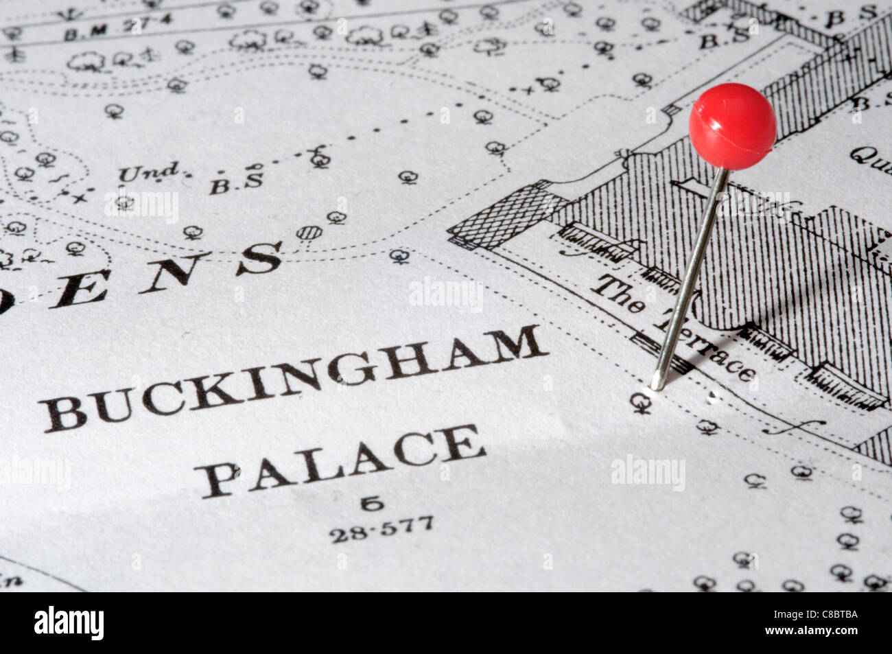 Buckingham Palace in London indicated using a map pin. Map is an out-of-copyright 1894 edition. Stock Photo
