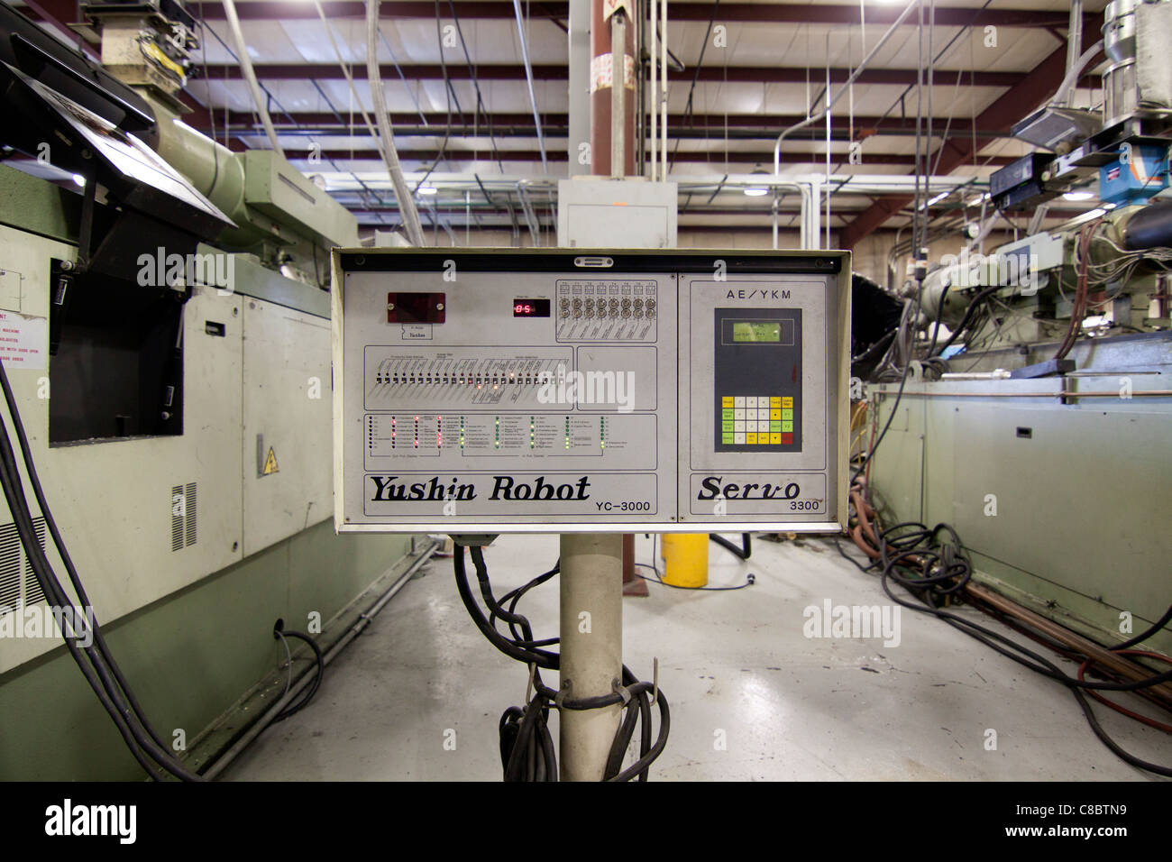 A Yushin Robot Servo control panel at a plastic molding injection plant in Hudson, Colorado, USA. Stock Photo