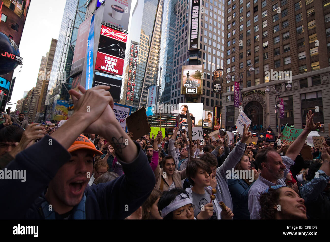 Thousands of Occupy Wall Street Protesters marching in Times Square New York City on October 15th 2011 Stock Photo