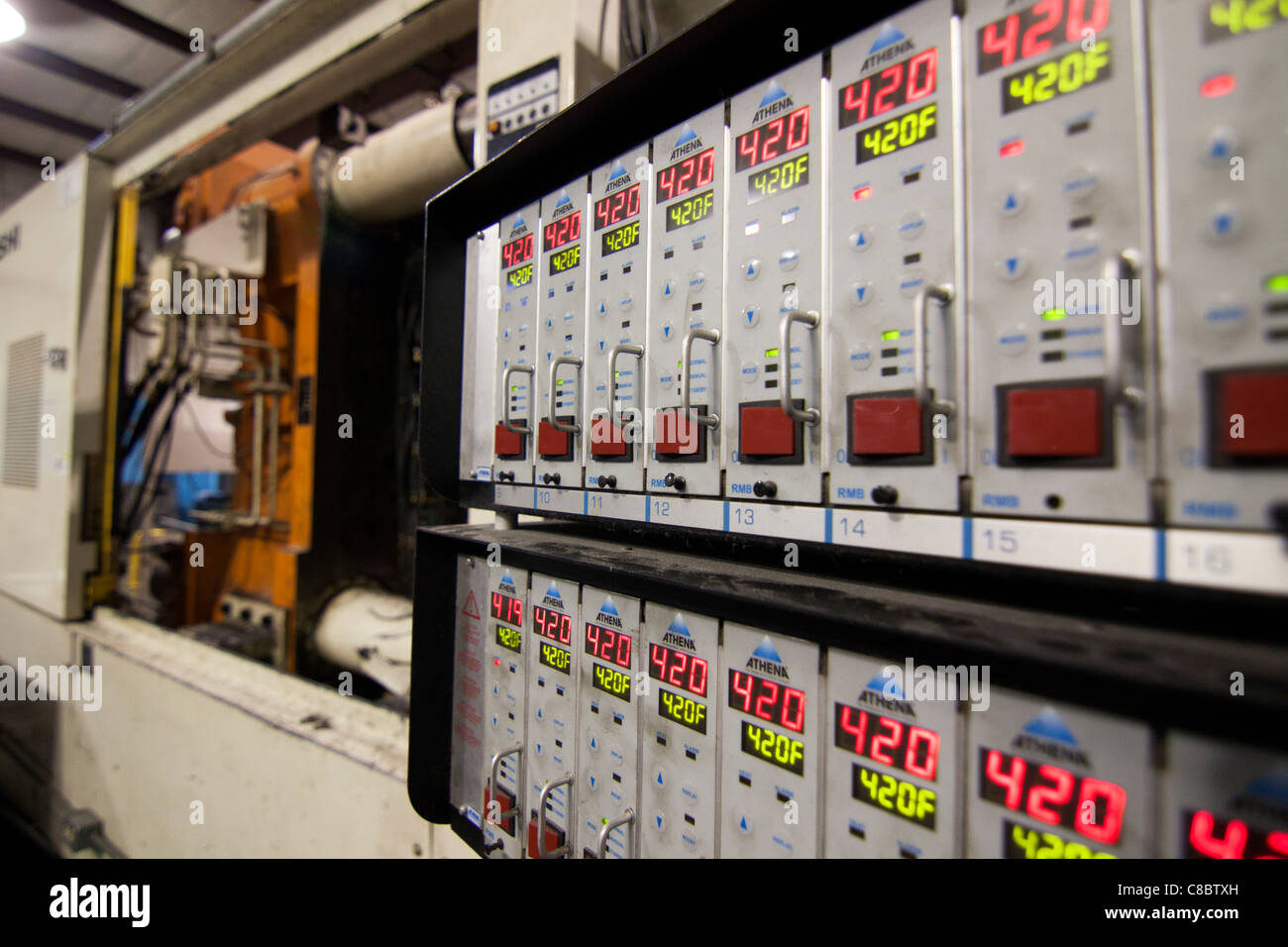 An athena temperature control panel at a plastics molding injection