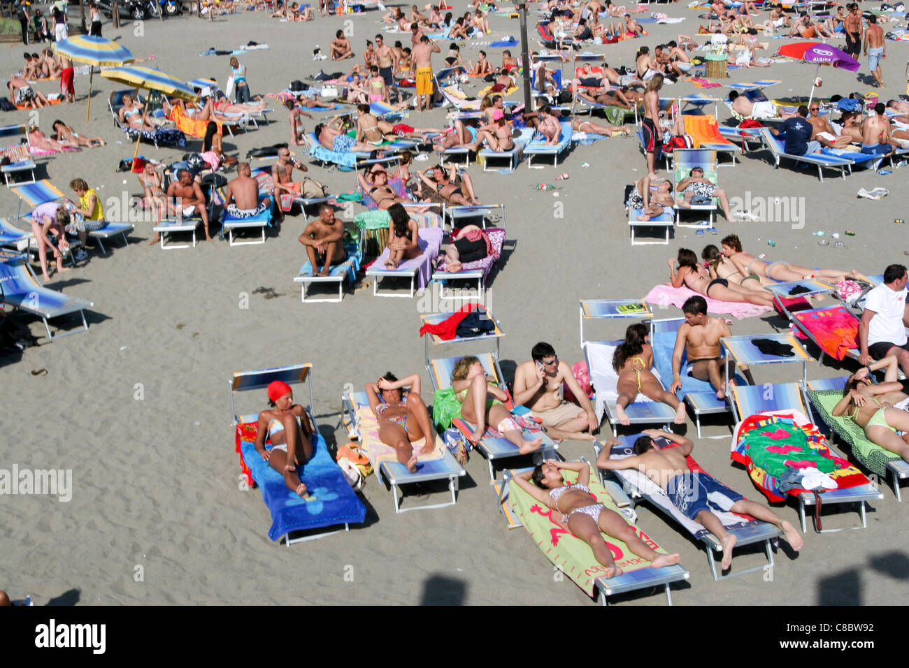 people sunbathing in Ostia beach Italy Stock Photo