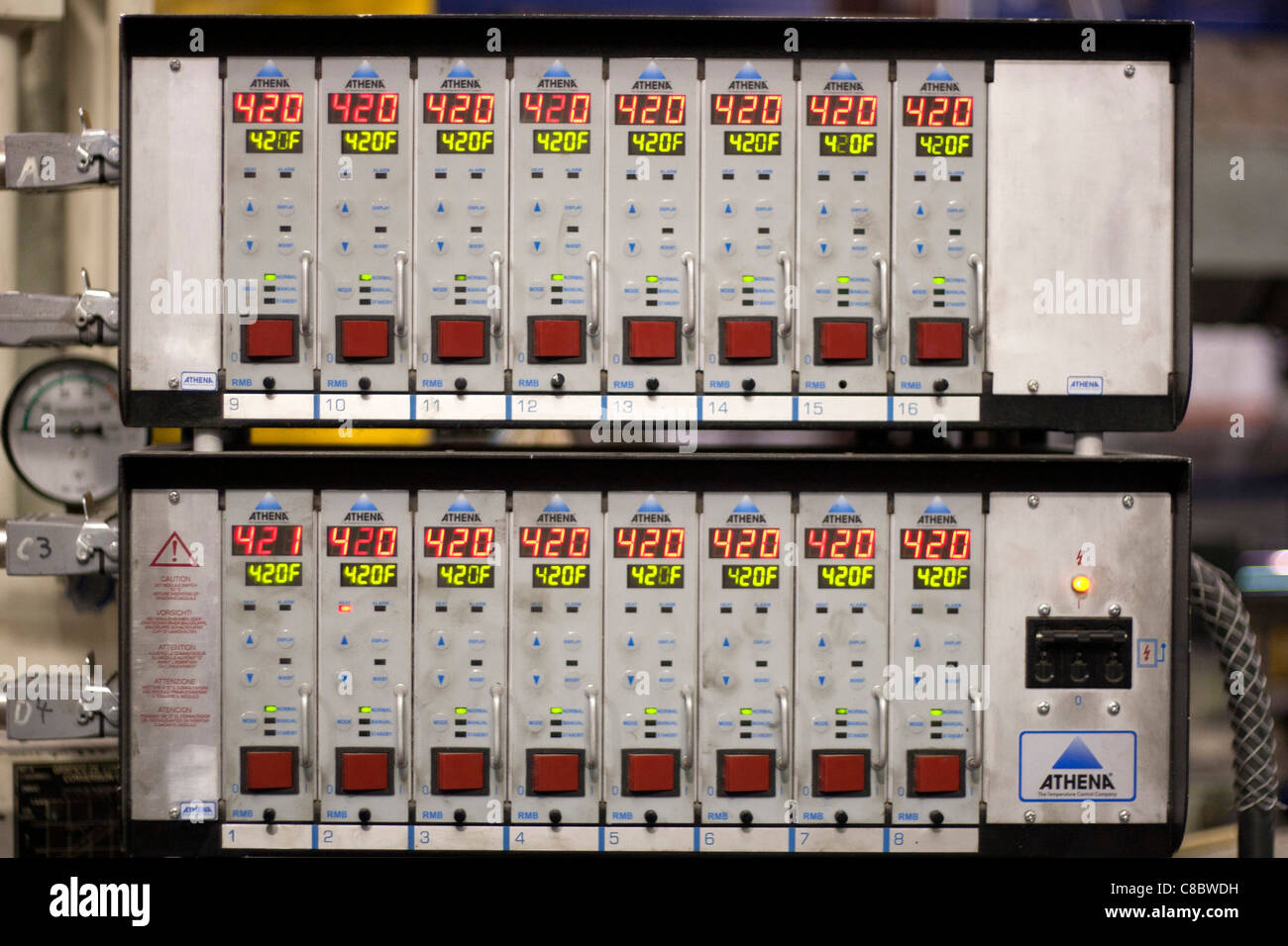 An athena temperature control panel at a plastics molding injection