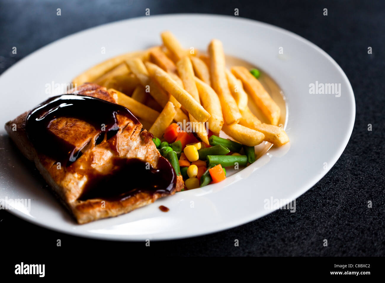 salmon steak with French Fries Stock Photo