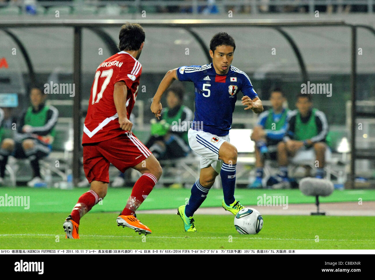 Yuto Nagatomo (JPN) and Dilshod Vasiev (TJK) play during the 2014 FIFA World Cup Asian Qualifiers : Japan 8-0 Tajikistan. Stock Photo