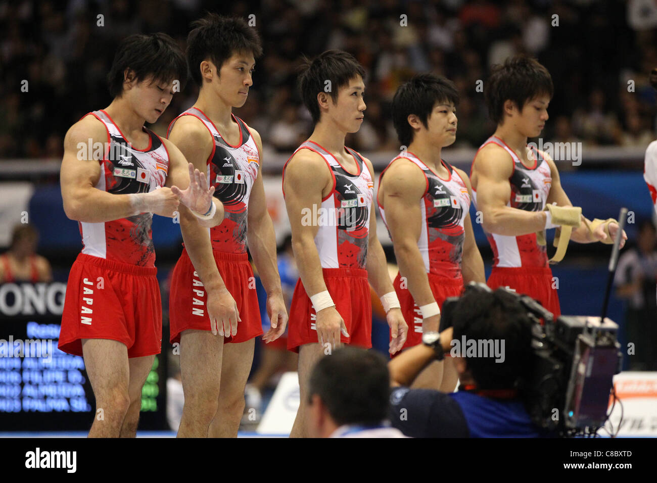 Japan team group line-up during the 2011 World Artistic Gymnastics Championships. Stock Photo