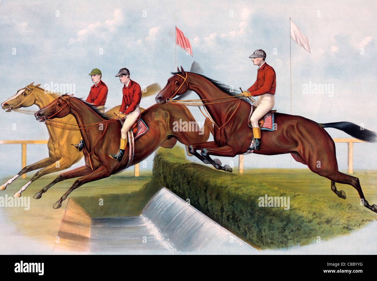 The water jump Horses and liders leaping a water barrier Stock Photo