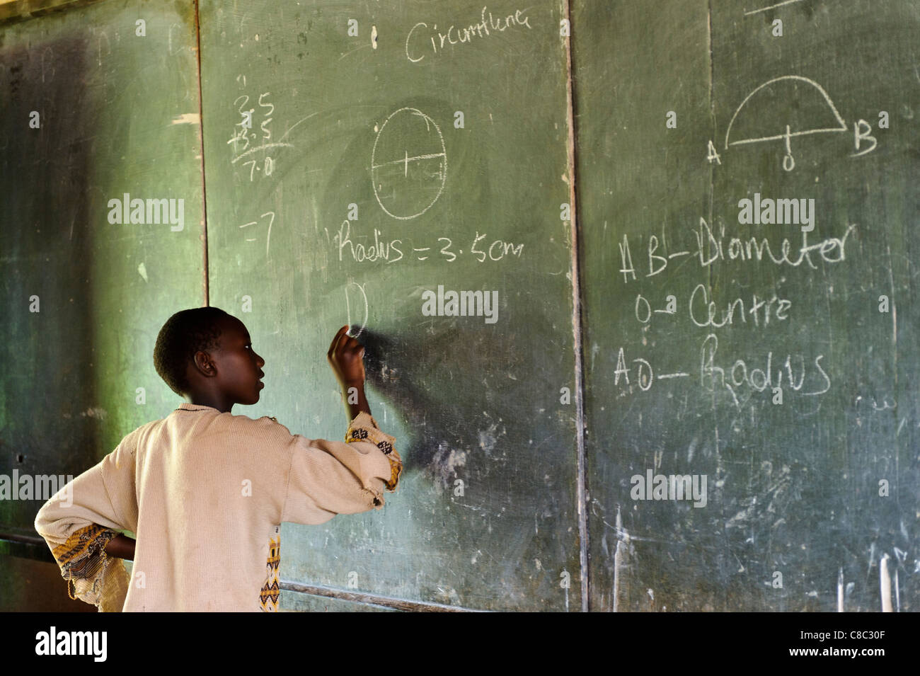 Student learning maths at a small school, Thika, Kenya Stock Photo - Alamy
