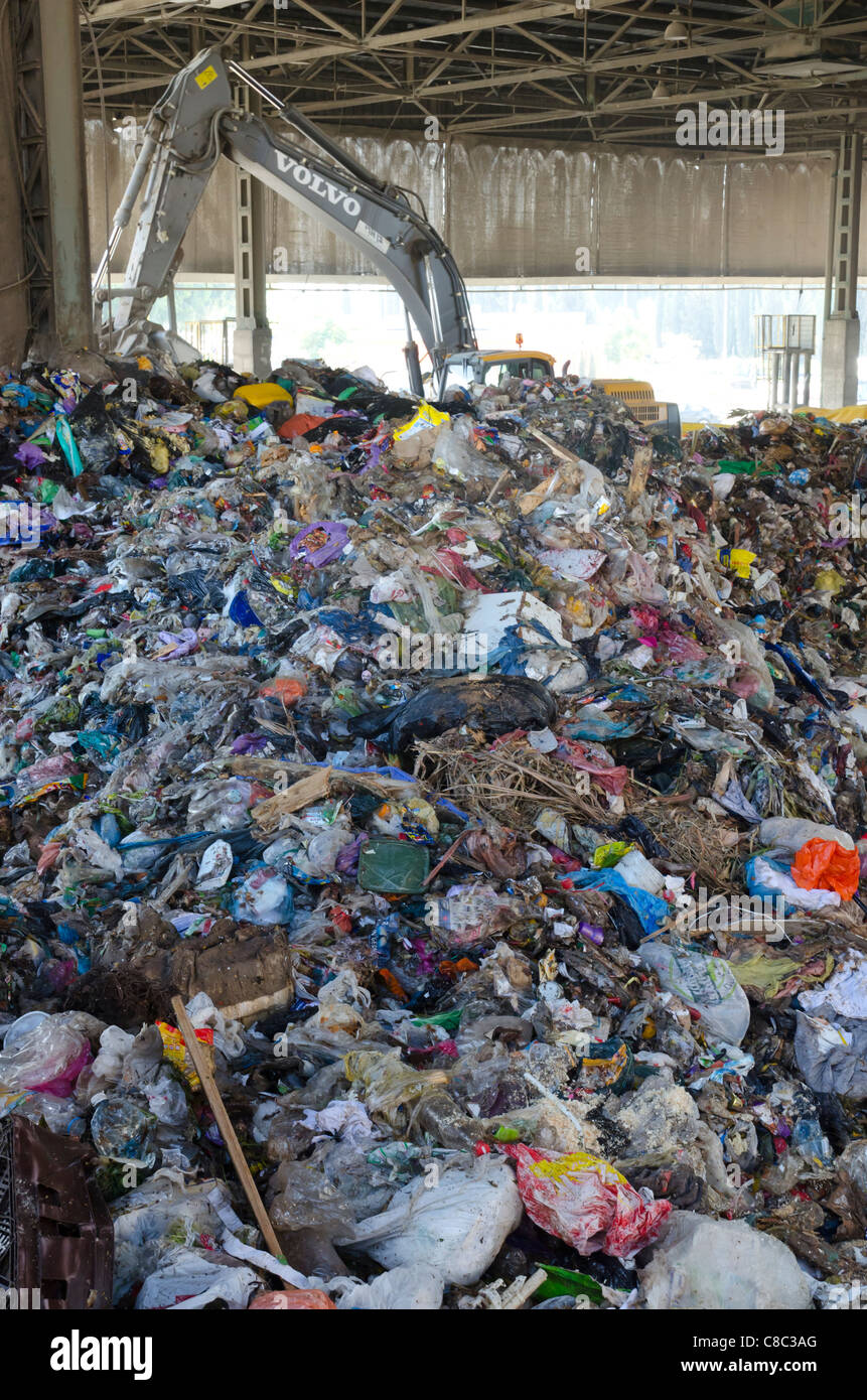 heap of rubbish with crane at Hiriah rubbish collection center. Israel