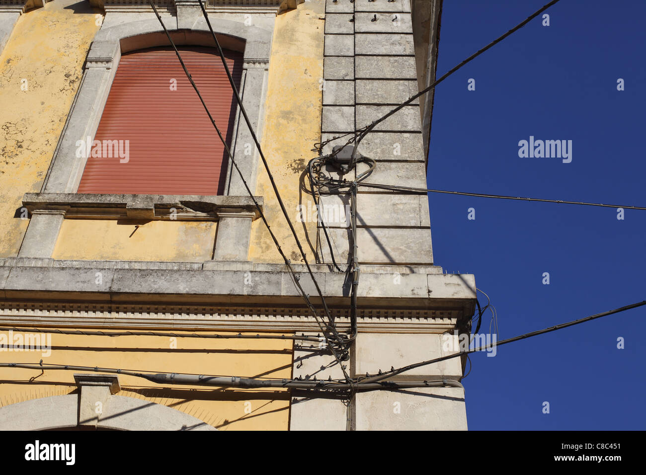 Electrical wiring on a building in Italy. Stock Photo